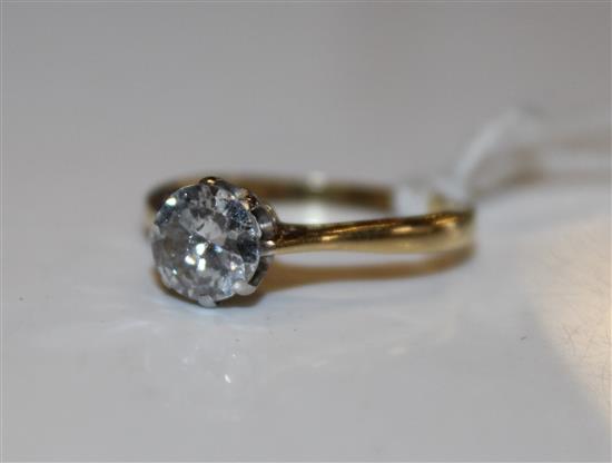 An 18ct gold and platinum, solitaire diamond ring, size O.(-)